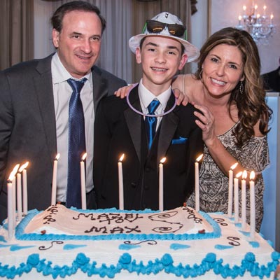 Family Celebrating Mitzvah with Cake