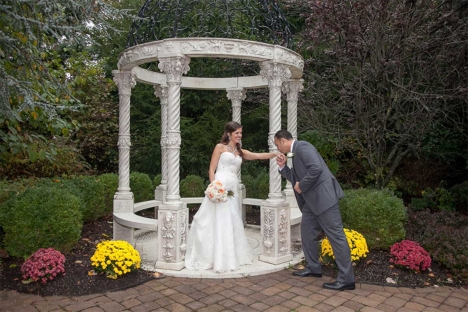 Groom Kissing Bride Outdoor Wedding Garden