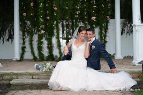 Bride Holding Groom Outdoor Wedding Ceremony