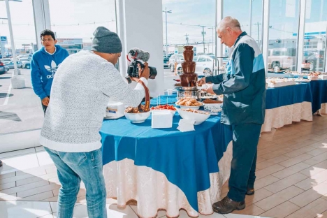 Happy Guest Enjoying Dessert Chocolate Fountain Off Premise Catering