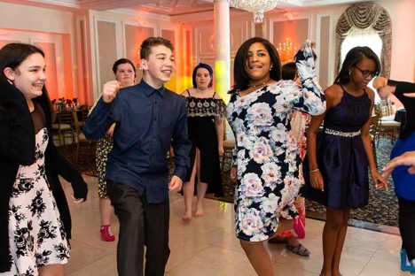 Teens Dancing At Mitvah Party In Ballroom